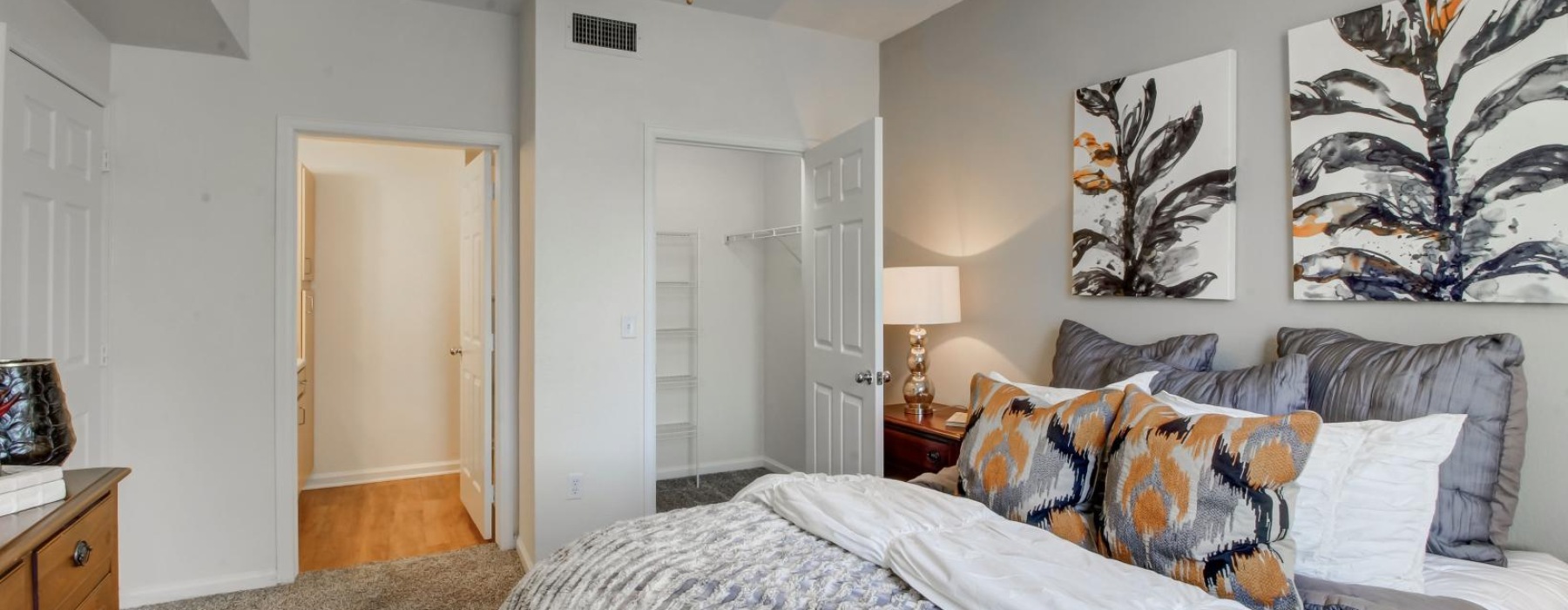 a bedroom with a bed and a lamp