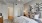 a bedroom with a bed and a lamp