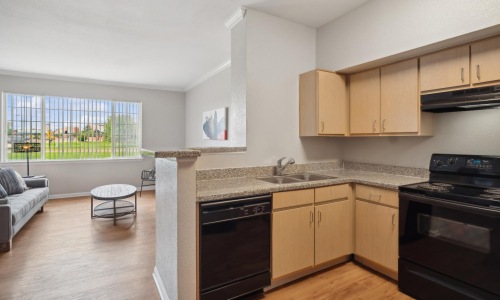 a kitchen with wooden cabinets
