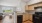 a kitchen with wooden cabinets