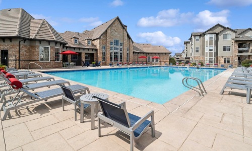 a pool with chairs around it