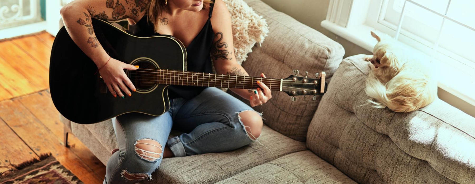 a woman playing a guitar