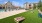 a cornhole area with chairs and tables and a pool