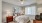 a bedroom with a bed and lamps