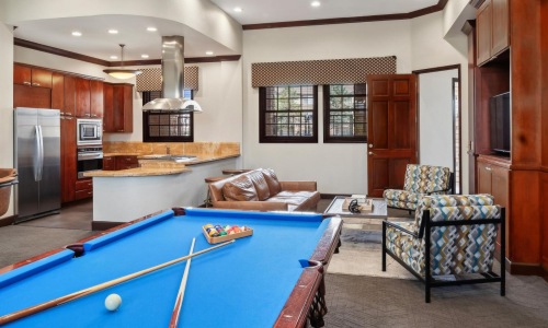 a pool table in a clubhouse room