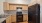 a kitchen with wooden cabinets